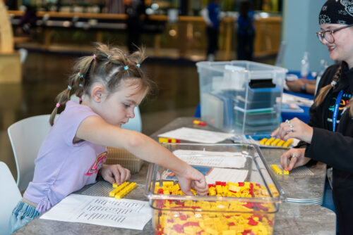 Student writes name in morse code using legos.